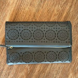 Die-cut clutch with removable chain. Excellent condition.